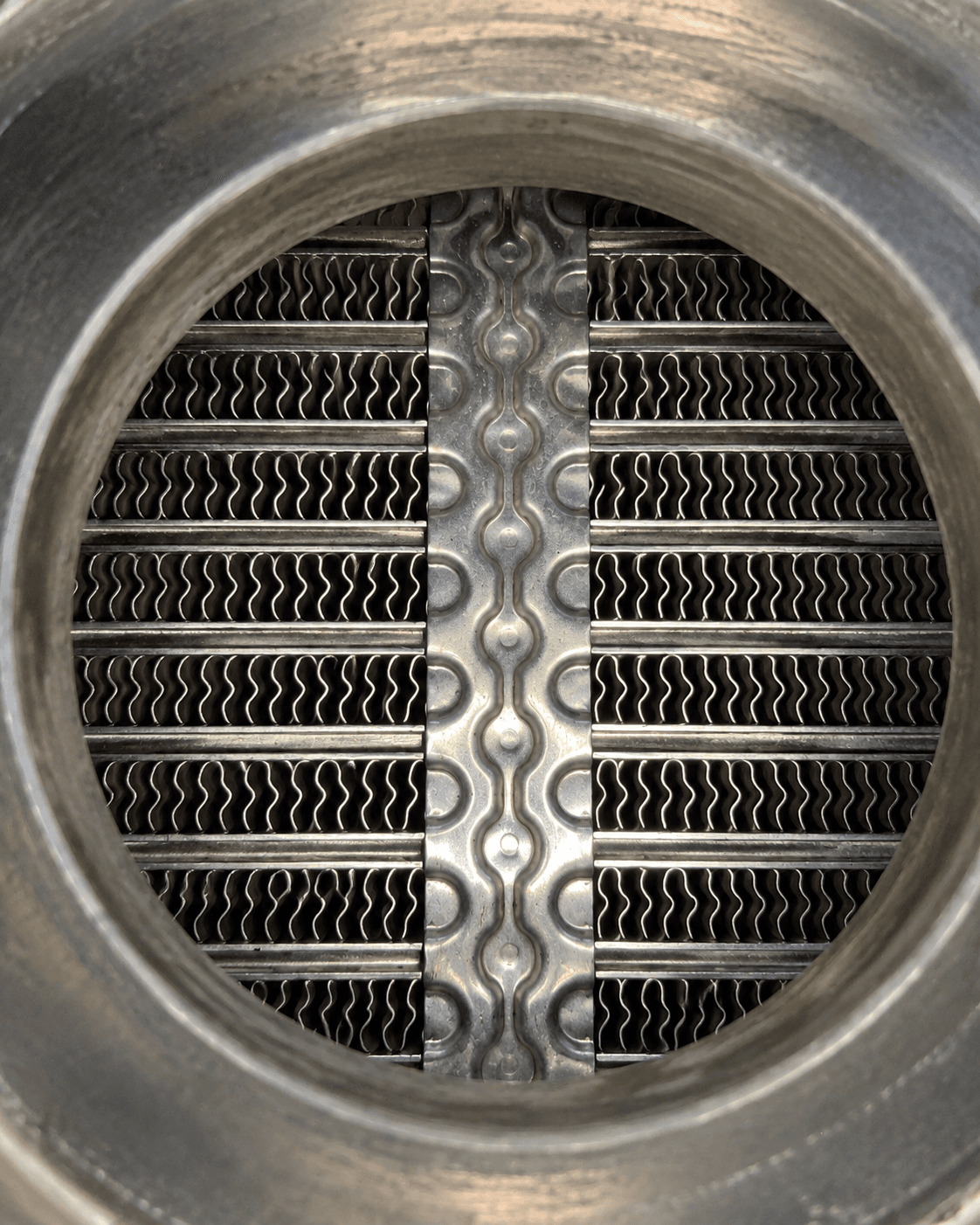 EGR cooler core with visibly cleaner internal passages after cleaning