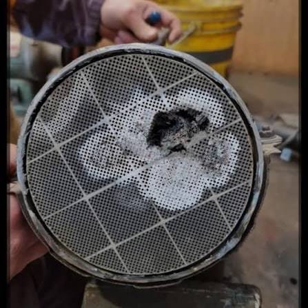 Destroyed melted ceramic DPF substrate requiring replacement